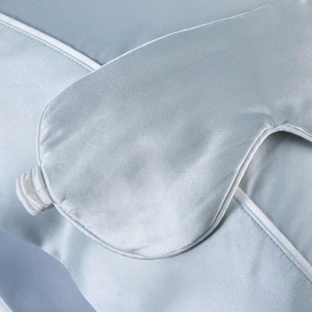 Light blue silk eye mask and pillowcase with piping detail