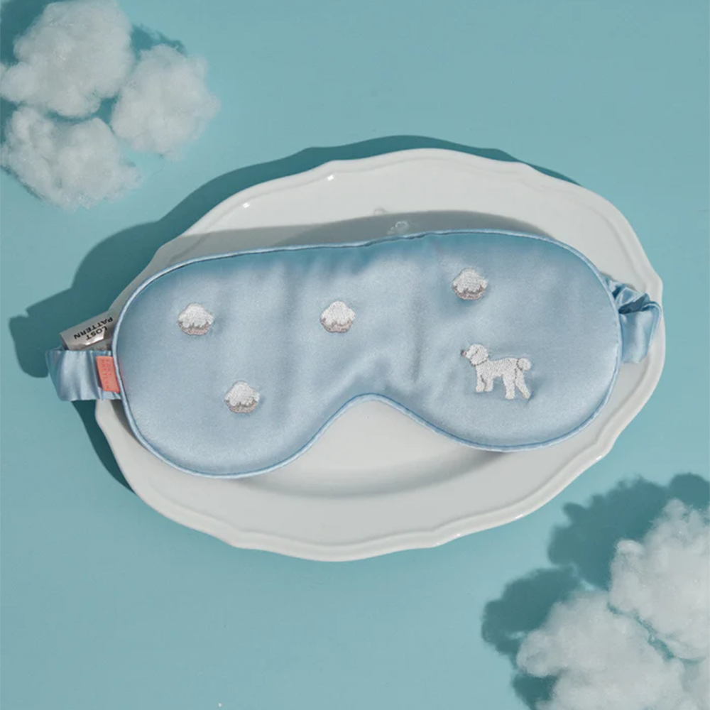 Light blue embroidered silk eye mask with cloud props