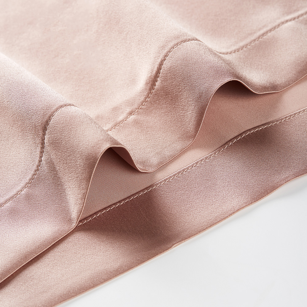 Bottom hem stitching close up of silk bathrobe